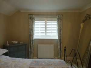 Small Bedroom Window With White Shutters