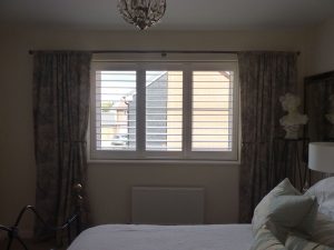 White Window Shutters In The Bedroom