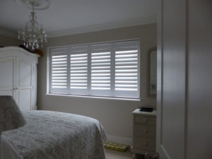 White Louvered Shutters On Bedroom Window