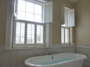 White Top Opening Tier Of Tier Shutters Above Bath