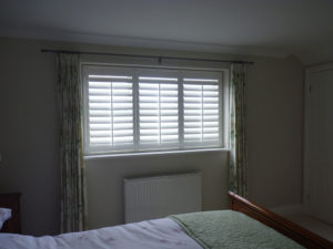 White Shutters With Tposts In Bedroom Window