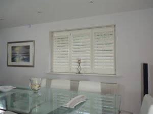 Cream Shutters With TPosts In Dining Room